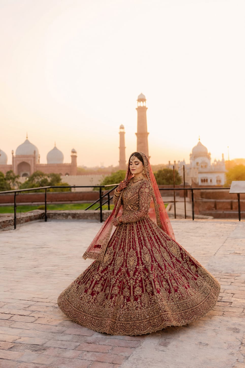A bride photographed at sunset with Lahore heritage architecture visible